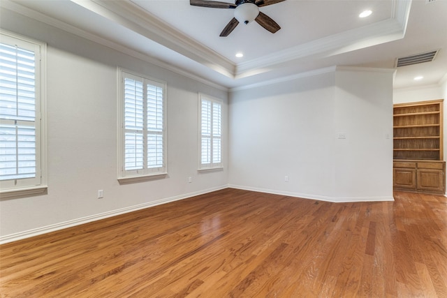 805 Evergreen Ct, Keller, TX 76248 - empty room with ceiling fan, crown molding, wood finished floors, a raised ceiling, and baseboards