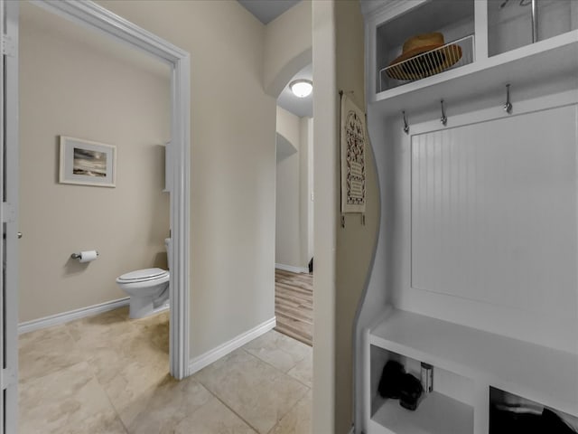 1316 Heather Ln, Little Elm, TX 75068 - mudroom with arched walkways and light tile patterned floors