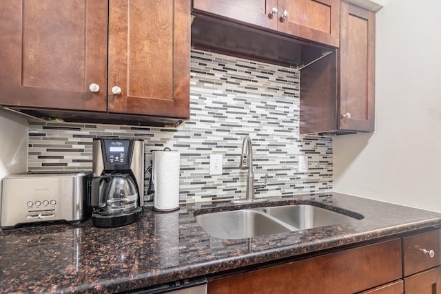 4317 Hartford St Unit 102, Dallas, TX 75219 - kitchen featuring decorative backsplash and dark stone counters