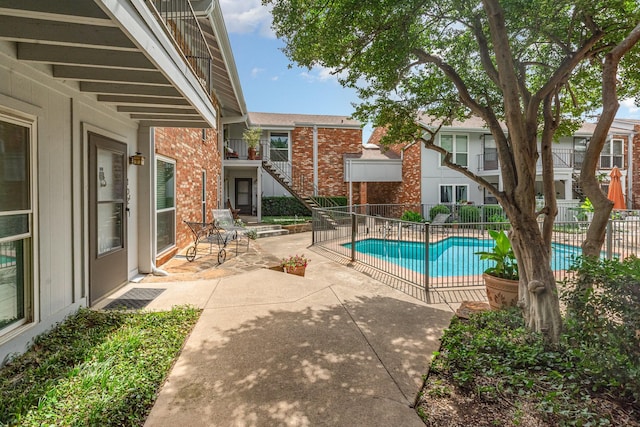 4317 Hartford St Unit 102, Dallas, TX 75219 - view of swimming pool with a patio