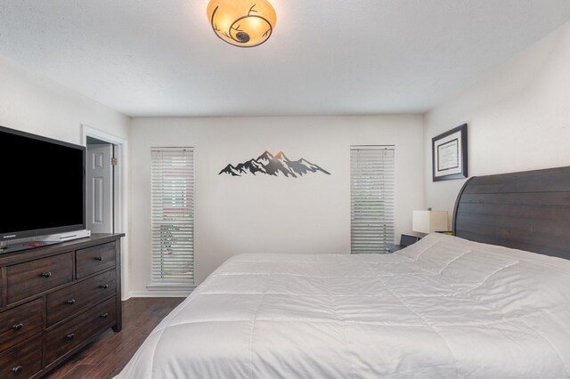 4317 Hartford St Unit 102, Dallas, TX 75219 - bedroom with dark wood-type flooring and baseboards