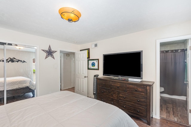 4317 Hartford St Unit 102, Dallas, TX 75219 - bedroom featuring wood finished floors, a closet, and ensuite bath