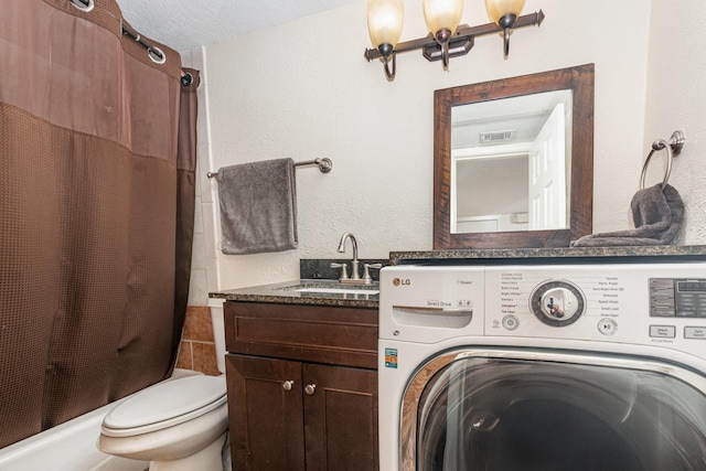 4317 Hartford St Unit 102, Dallas, TX 75219 - bathroom featuring washer / clothes dryer, shower / bath combo, a textured wall, toilet, and vanity