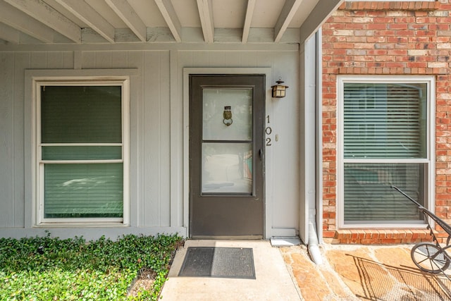 4317 Hartford St Unit 102, Dallas, TX 75219 - property entrance with brick siding and board and batten siding