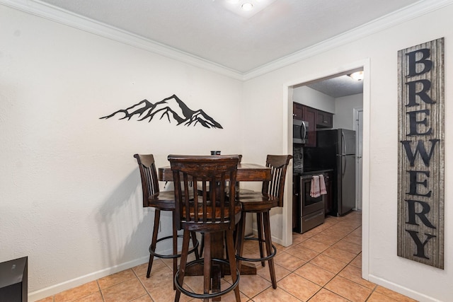 4317 Hartford St Unit 102, Dallas, TX 75219 - dining space featuring crown molding and light tile patterned floors