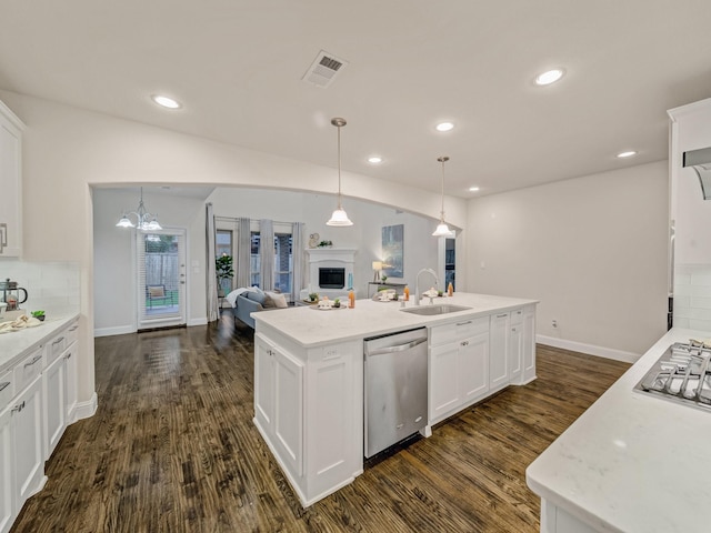 413 Winehart St, Lewisville, TX 75056 - kitchen featuring stainless steel appliances, a sink, dark wood-style flooring, white cabinets, and recessed lighting