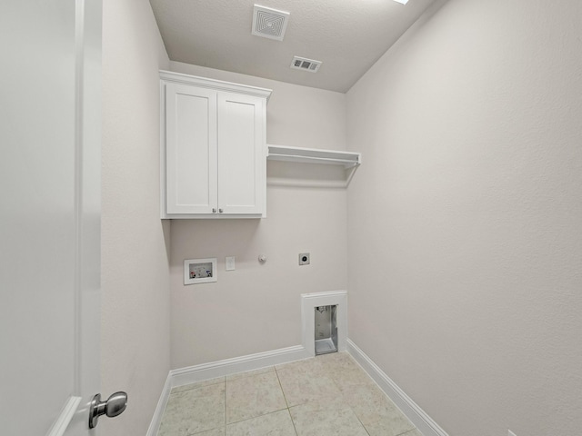 413 Winehart St, Lewisville, TX 75056 - laundry room with electric dryer hookup, washer hookup, hookup for a gas dryer, baseboards, and cabinet space