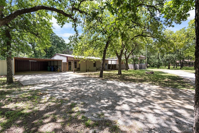 108 Boca Vista Ct, Chico, TX 76431 - view of front facade with concrete driveway and an outbuilding