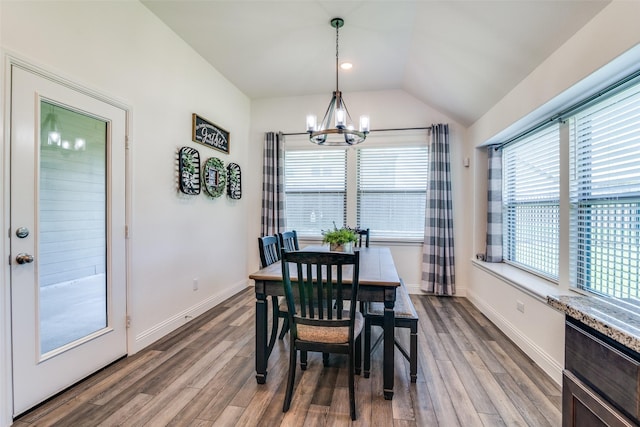 200 Tallgrass Dr, Lavon, TX 75166 - dining area with a chandelier, wood finished floors, baseboards, and lofted ceiling