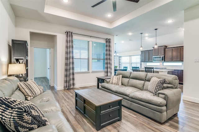 200 Tallgrass Dr, Lavon, TX 75166 - living room featuring ceiling fan, light wood-style flooring, a raised ceiling, baseboards, and recessed lighting