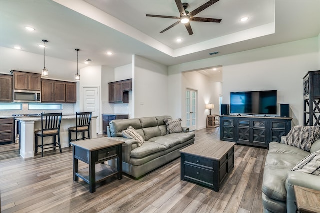 200 Tallgrass Dr, Lavon, TX 75166 - living room featuring a ceiling fan, wood finished floors, recessed lighting, and a raised ceiling