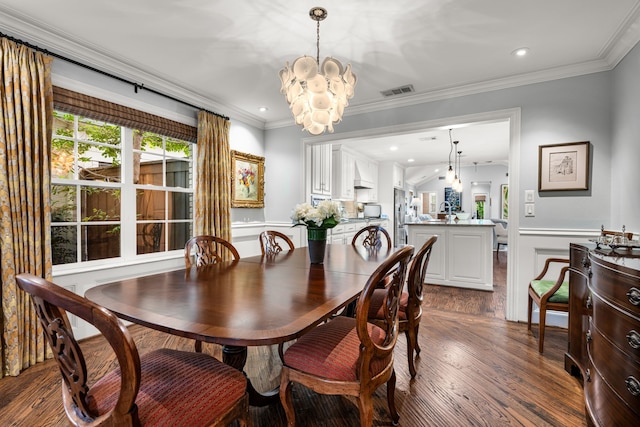 5507 W Amherst Ave, Dallas, TX 75209 - dining space featuring a chandelier, dark wood finished floors, a wainscoted wall, ornamental molding, and recessed lighting