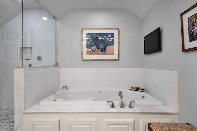 5507 W Amherst Ave, Dallas, TX 75209 - bathroom with a bath, lofted ceiling, and tiled shower