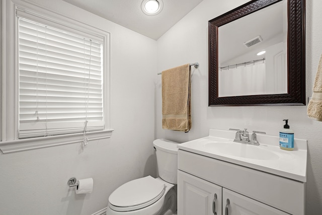 5507 W Amherst Ave, Dallas, TX 75209 - full bathroom featuring vanity, toilet, and baseboards