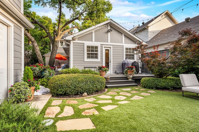5507 W Amherst Ave, Dallas, TX 75209 - rear view of house featuring a lawn and a wooden deck