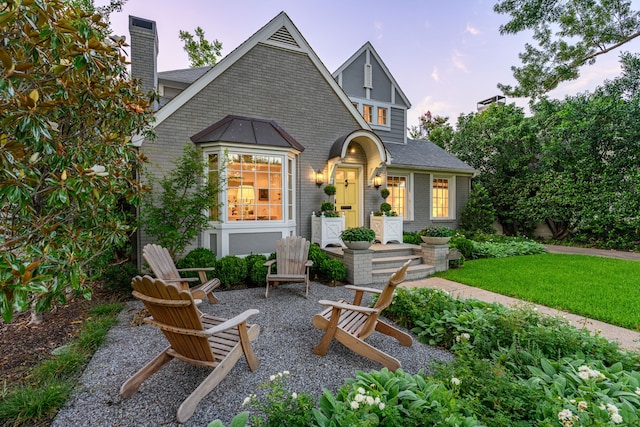 5507 W Amherst Ave, Dallas, TX 75209 - tudor house with a chimney, brick siding, and a shingled roof