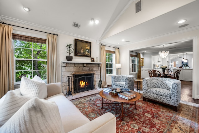 5507 W Amherst Ave, Dallas, TX 75209 - living room with crown molding, plenty of natural light, a stone fireplace, wood finished floors, and a chandelier
