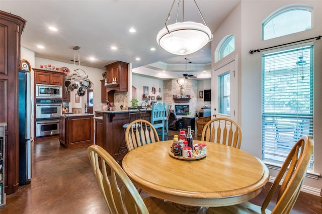 4401 Oak Shores Cir, Cross Roads, TX 76227 - dining room with a ceiling fan, recessed lighting, a fireplace, and finished concrete flooring