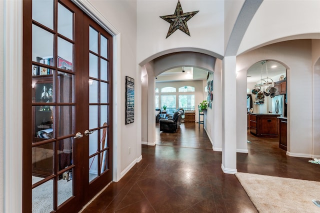 4401 Oak Shores Cir, Cross Roads, TX 76227 - foyer entrance featuring baseboards, french doors, and arched walkways