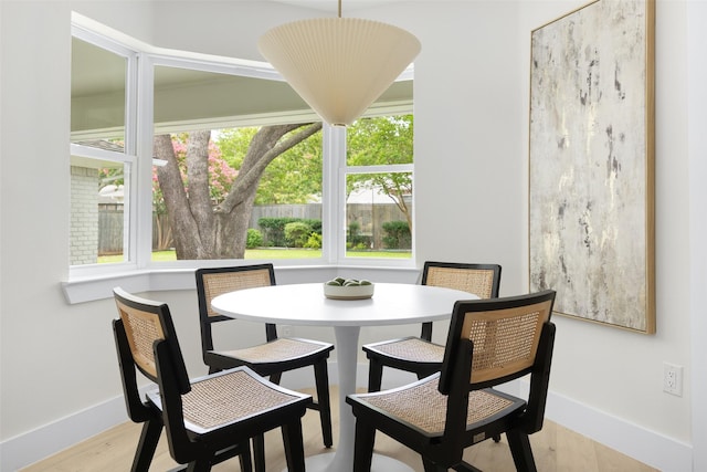 7716 Roundrock Rd, Dallas, TX 75248 - dining room with baseboards and light wood-type flooring