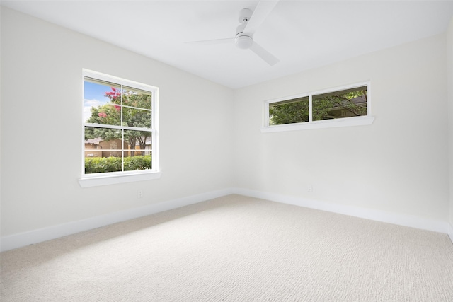7716 Roundrock Rd, Dallas, TX 75248 - empty room with healthy amount of natural light, carpet flooring, and a ceiling fan