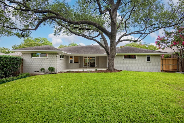 7716 Roundrock Rd, Dallas, TX 75248 - rear view of property with a patio and brick siding