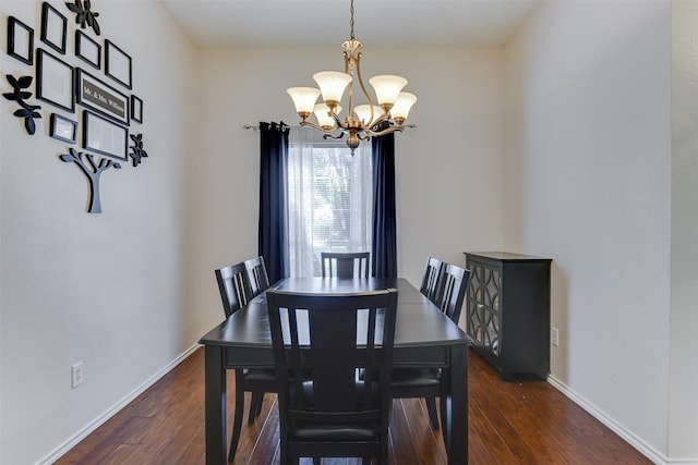 4546 Brittany Ln, Grand Prairie, TX 75052 - dining area featuring a chandelier, dark wood finished floors, and baseboards