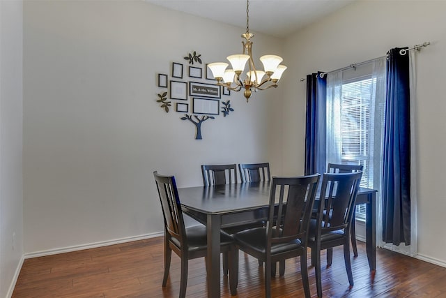 4546 Brittany Ln, Grand Prairie, TX 75052 - dining area featuring a chandelier, wood-type flooring, and baseboards