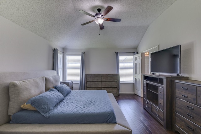 4546 Brittany Ln, Grand Prairie, TX 75052 - bedroom with a textured ceiling, multiple windows, dark wood-type flooring, a ceiling fan, and vaulted ceiling