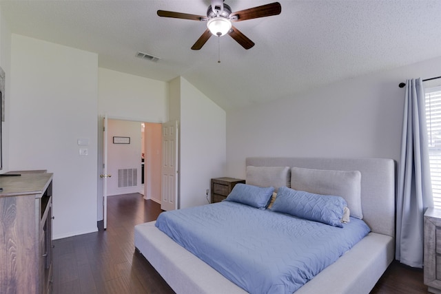 4546 Brittany Ln, Grand Prairie, TX 75052 - bedroom featuring dark wood-style flooring, lofted ceiling, a ceiling fan, a textured ceiling, and baseboards