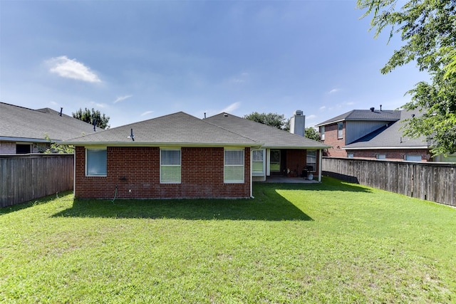 4546 Brittany Ln, Grand Prairie, TX 75052 - rear view of property featuring brick siding, roof with shingles, and a chimney