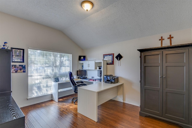 4546 Brittany Ln, Grand Prairie, TX 75052 - home office featuring a textured ceiling, lofted ceiling, wood finished floors, and baseboards