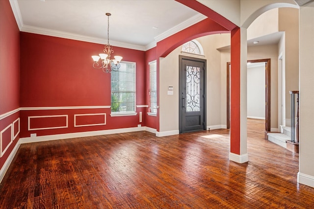 2720 Chapel Springs Dr, Highland Village, TX 75077 - entryway featuring arched walkways, wood finished floors, a chandelier, ornamental molding, and baseboards