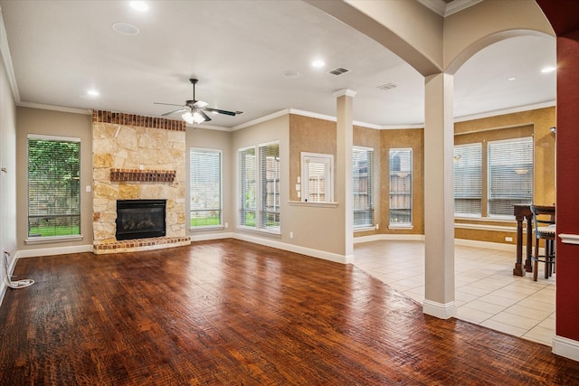2720 Chapel Springs Dr, Highland Village, TX 75077 - unfurnished living room featuring wood finished floors, a ceiling fan, a stone fireplace, healthy amount of natural light, and recessed lighting