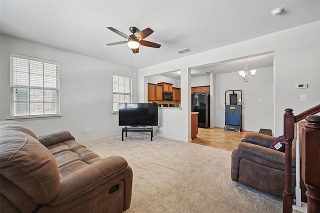2932 Peyton Brook Dr, Fort Worth, TX 76137 - living area featuring ceiling fan, light colored carpet, a chandelier, and baseboards