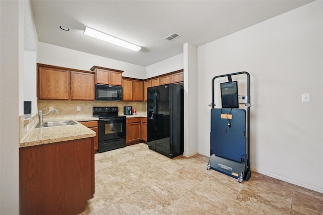 2932 Peyton Brook Dr, Fort Worth, TX 76137 - kitchen with black appliances, a sink, backsplash, brown cabinetry, and light countertops