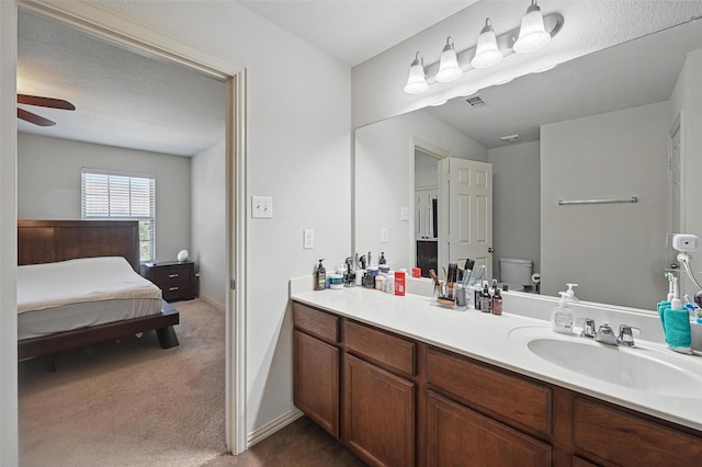 2932 Peyton Brook Dr, Fort Worth, TX 76137 - bathroom with toilet, vanity, ceiling fan, and connected bathroom