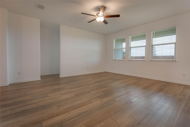 3616 Mallard Way, Mckinney, TX 75071 - spare room with ceiling fan, wood finished floors, and baseboards