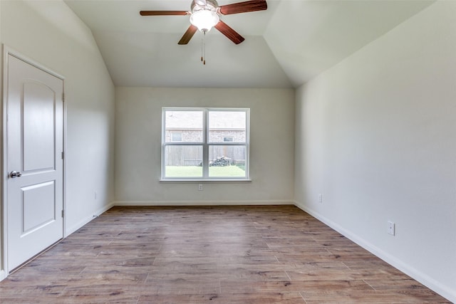 4201 Tower Ln, Crowley, TX 76036 - unfurnished room featuring a ceiling fan, lofted ceiling, wood finished floors, and baseboards