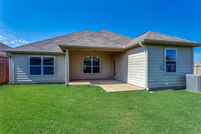4201 Tower Ln, Crowley, TX 76036 - rear view of house with central AC unit, a patio area, and roof with shingles