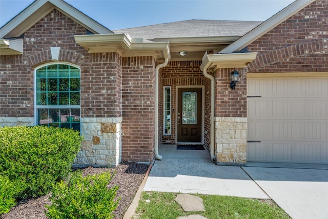 4201 Tower Ln, Crowley, TX 76036 - doorway to property featuring brick siding, a garage, concrete driveway, and roof with shingles