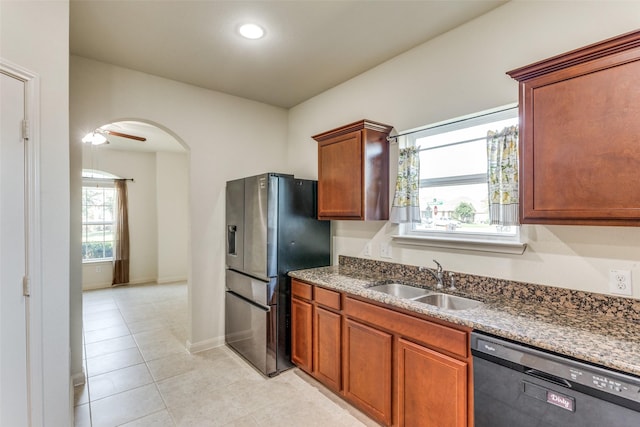 4201 Tower Ln, Crowley, TX 76036 - kitchen featuring dishwasher, a sink, stainless steel refrigerator with ice dispenser, arched walkways, and light tile patterned floors