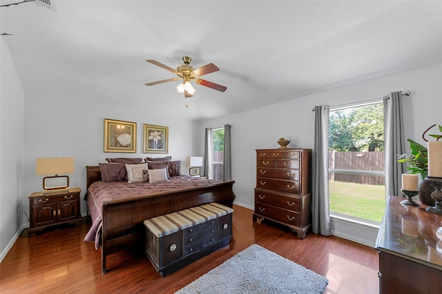 2312 Collier Dr, Mckinney, TX 75071 - bedroom with dark wood finished floors, multiple windows, baseboards, and a ceiling fan