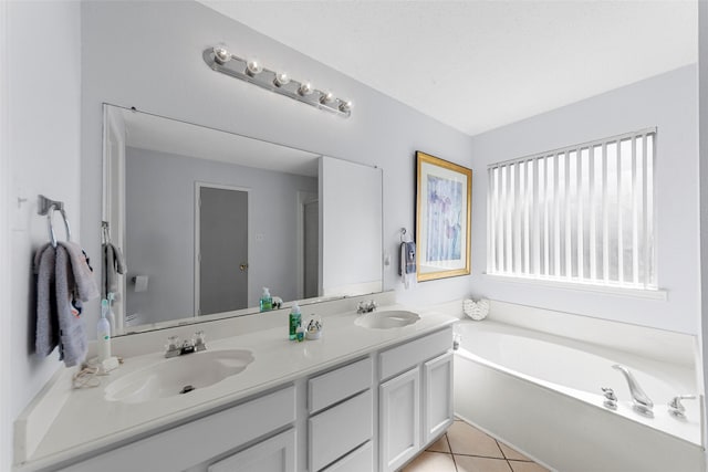 2312 Collier Dr, Mckinney, TX 75071 - full bathroom with double vanity, a bath, and tile patterned floors