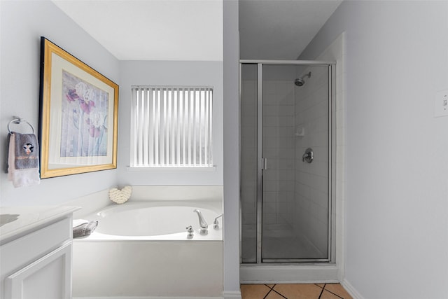 2312 Collier Dr, Mckinney, TX 75071 - bathroom with a garden tub, a stall shower, tile patterned floors, and vanity
