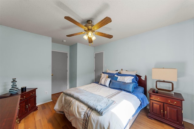 2312 Collier Dr, Mckinney, TX 75071 - bedroom featuring light wood-style flooring, a ceiling fan, and baseboards