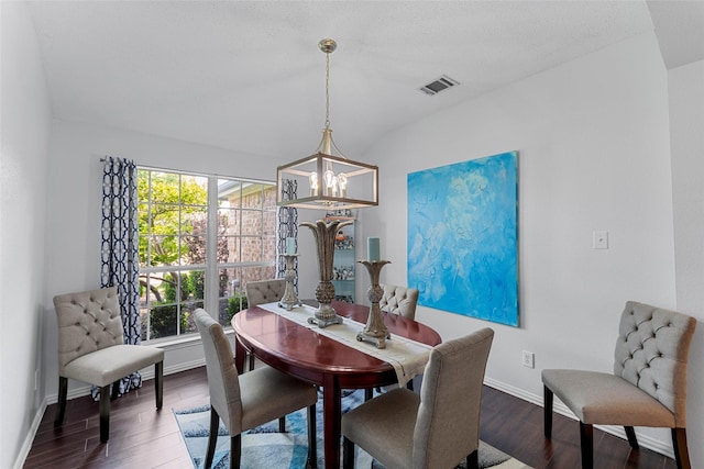 2312 Collier Dr, Mckinney, TX 75071 - dining area with a chandelier, wood finished floors, and baseboards