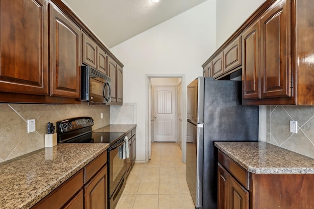 1336 Castlegar Ln, Fort Worth, TX 76247 - kitchen featuring black appliances, light tile patterned floors, tasteful backsplash, high vaulted ceiling, and baseboards