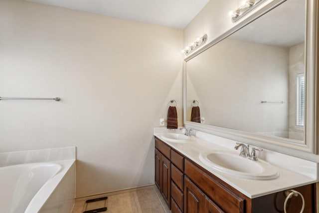 1336 Castlegar Ln, Fort Worth, TX 76247 - bathroom with double vanity, a bath, tile patterned floors, and baseboards