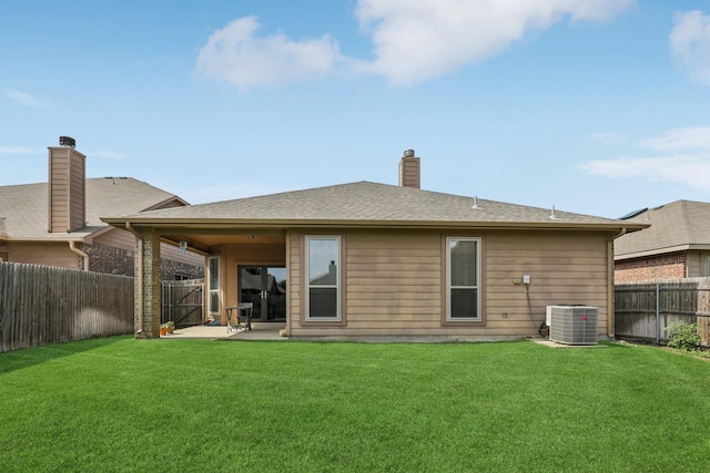 1336 Castlegar Ln, Fort Worth, TX 76247 - back of property with a patio area, cooling unit, and a chimney